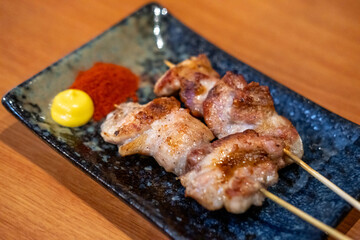 Yakitori, a Japanese type of skewered chicken served on plate