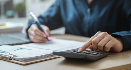 Accountant used a calculator financial analysis managing payroll tax accounting budget accounts.
