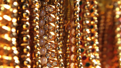 Decorative pearl chains on display in a fashion shop