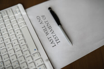 Last Will and Testament Document with Pen and Keyboard Reflecting Legal Formalities