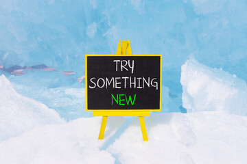 Try something new symbol. Concept words Try something new on beautiful blackboard. Beautiful blue...