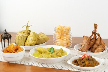 Opor Ayam, served with ketupat and sambal goreng ati. Popular during Eid al Fitr. Indonesian traditional food
