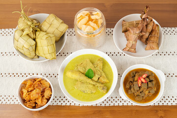 Opor Ayam, served with ketupat and sambal goreng ati. Popular during Eid al Fitr. Indonesian traditional food
