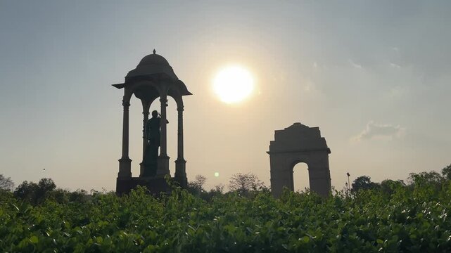 Netaji Subhash Chandra Bose Memorial and the India Gate war memorial at sunset, in New Delhi, India