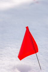 Red flags on snow, hazard warning