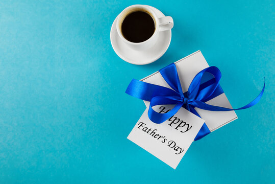 Accessories and decor, Father's Day greeting card, gift box and various accessories on blue background.