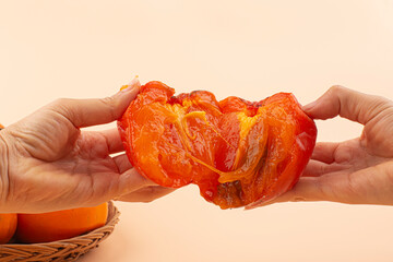 Slices of persimmon. Ripe orange persimmon fruit.