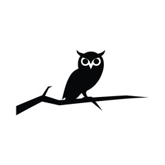 Owl silhouette perched on a branch
