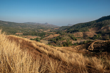 autumn landscape with mountains and blue sky