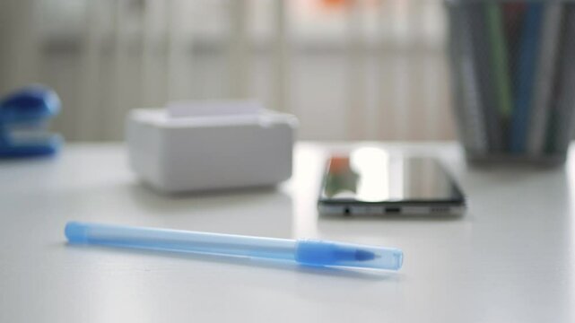 Blurred Shooting with a Mini Printer Printing a Document. Modern Technology, a Printer and a Smartphone Connected Using Internet App. 