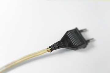 Broken  power plug cord with wires sticking out