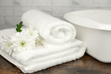 White terry towel. Cotton towel. White basin. Bathroom