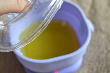 purple wax warmer containing melted yellow wax white waxing strips home professional waxing session hair removal treatments beauty skincare tutorial salon spa services removal kits waxing accessories