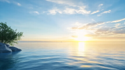 Obraz premium Serene sea with calm waters, a clear blue sky, and a sun setting in the background, creating a tranquil atmosphere as sunlight gently reflects on the water's surface.