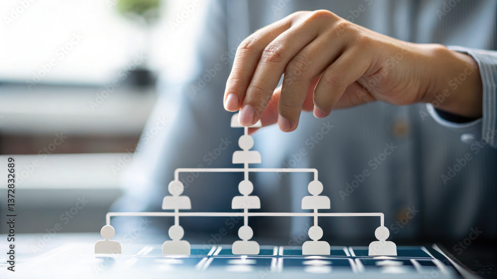 Poster hand is hovering over 3d staff hierarchy tree, symbolizing organizational structure and management