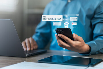 Businessman uses Chat Bot to chat with AI technology or artificial intelligence. Conversation with AI intelligent robot system to analyze data. Chatbot helps to solve work problems.