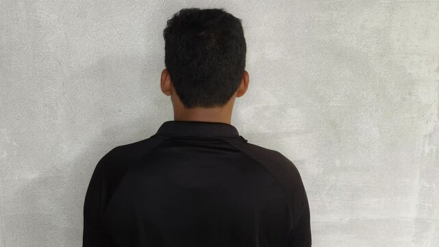 Young adult person with bad spinal bone posture sit straight to correct spine and shoulder position. Close up back side view. Backache, disc discomfort, muscle pain and body strain concept.