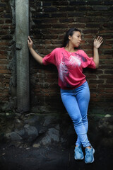 Stylish pose by the wall