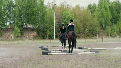 A Young Equestrian Enthusiast Riding a Beautiful Brown Horse in an Expansive Outdoor Arena