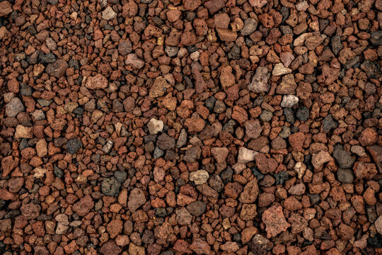 Close-up background texture of pic&oacute;n, lapilli, and reddish volcanic stones