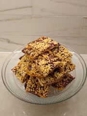 Delightful homemade chocolate and nut treats arranged beautifully on a glass plate ready to be enjoyed during a cozy gathering
