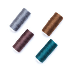 ull cross-wound spools of thin sewing tread