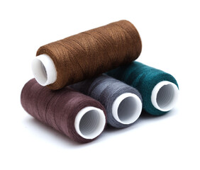ull cross-wound spools of thin sewing tread