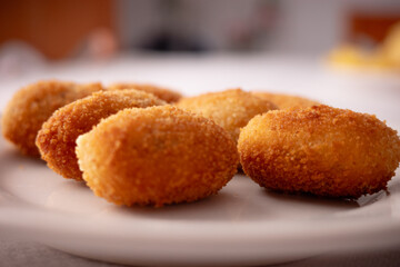 Delicious Golden Brown Croquettes on White Plate