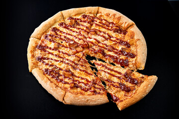 pizza with barbecue on a black background