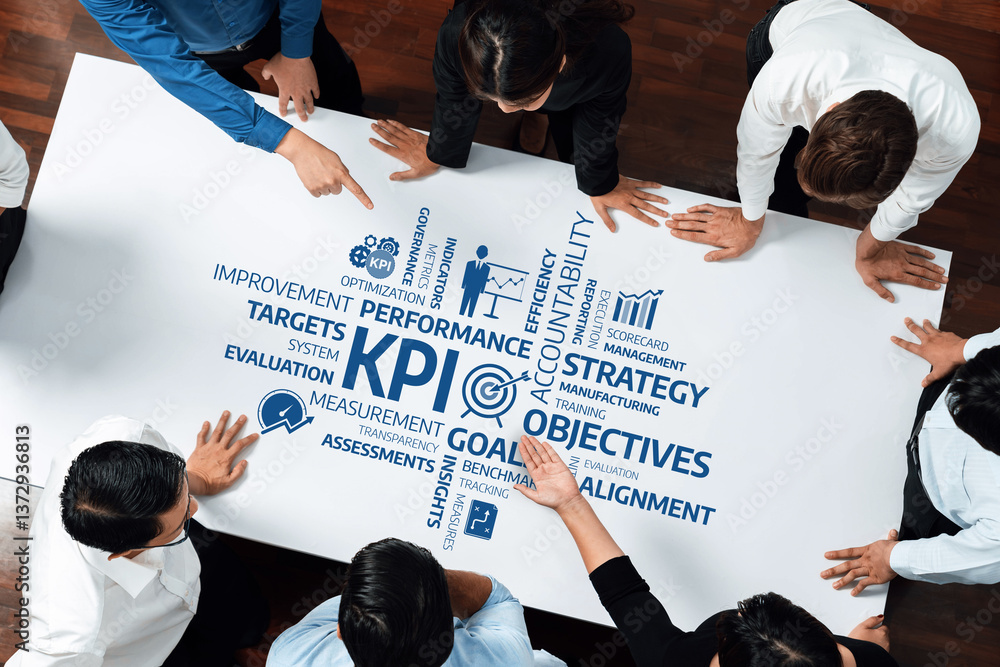 Poster a dynamic team engages in a collaborative strategy session, pointing at key performance indicators a