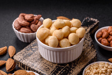 Raw peeled macadamia nut in ceramic bowl