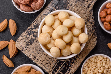 Raw peeled macadamia nut in ceramic bowl