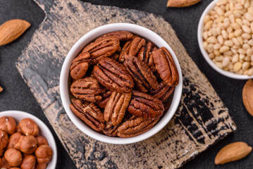 Nut, pecans in a ceramic bowl, an ingredient in vegan food
