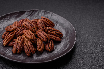 Nut, pecans in a ceramic bowl, an ingredient in vegan food