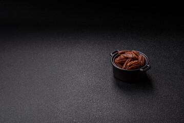 Nut, pecans in a ceramic bowl, an ingredient in vegan food