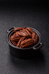 Nut, pecans in a ceramic bowl, an ingredient in vegan food