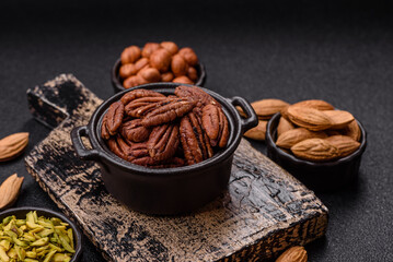 Nut, pecans in a ceramic bowl, an ingredient in vegan food