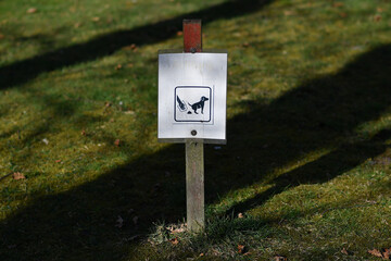 Sign indicating that dog waste should be collected by the owner