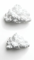 Two fluffy white clouds float on a bright white backdrop casting soft shadows and creating a minimalist calming atmosp