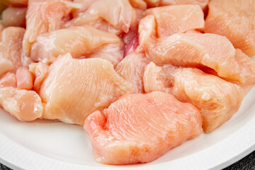 Chicken raw meat pieces of meat poultry tasty fresh delicious gourmet food background on table rustic food top view copy space keto and paleo diet