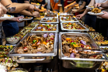 Buffet spread featuring a variety of dishes served at a gathering for friends during an evening...