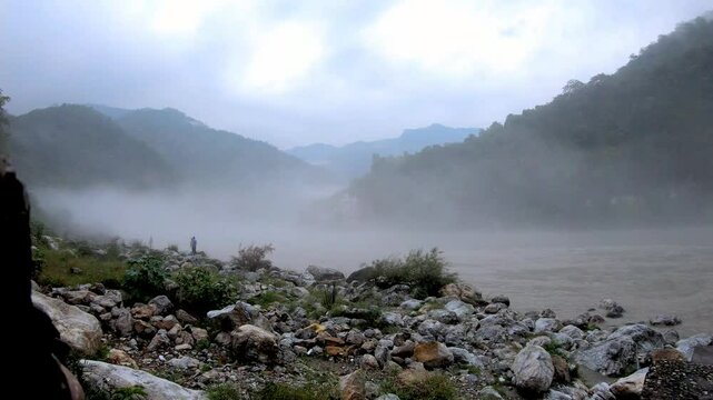 Rishikesh time lapse during monsoon with clouds on the river ganga in India