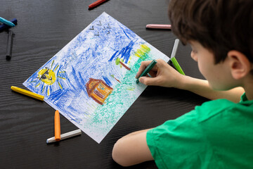 Focused Child in Green T-shirt Drawing with Crayons - Art Therapy for Autism, ADHD, and Digital...