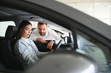 woman customer female buyer client chooses auto. Sales concept