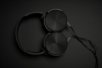 black headphones on a black background