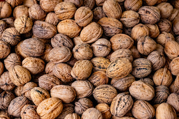 Freshly harvested walnuts in a rustic setting showcasing their natural texture and colors