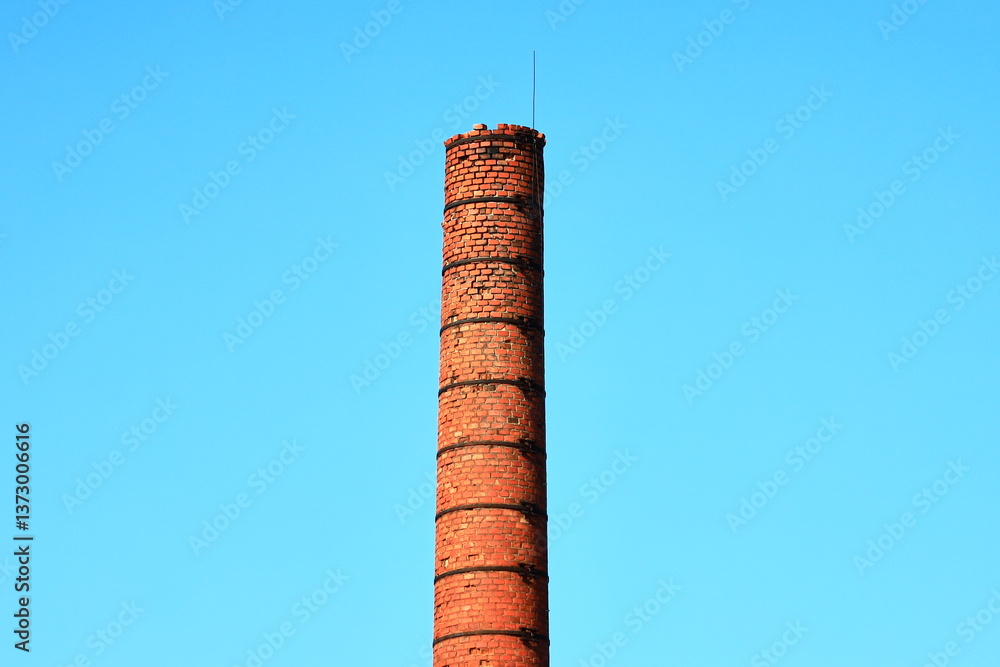 Aufkleber A historic building feature with clock and brick structure, suitable for backgrounds or architectural scenes.