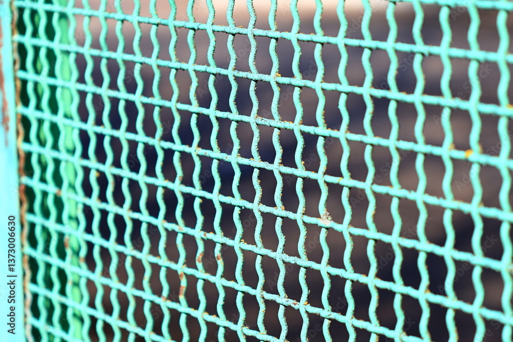Poster close-up shot of a fence with a blurred background.