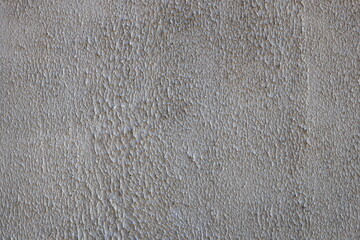 A close-up shot of a wall featuring a clock.