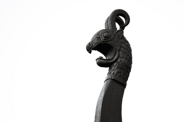 A classic black and white photograph of a statue of a ram.
